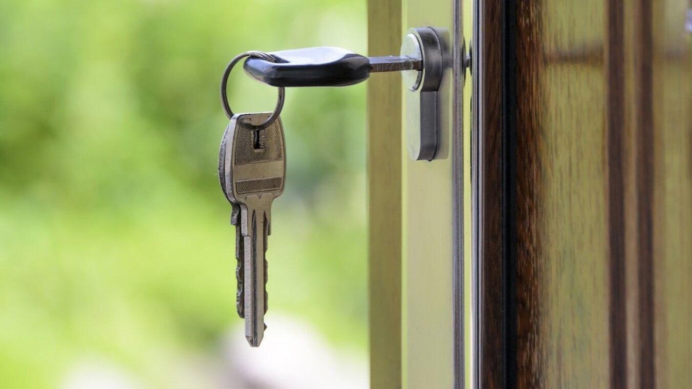 House with keys in front door