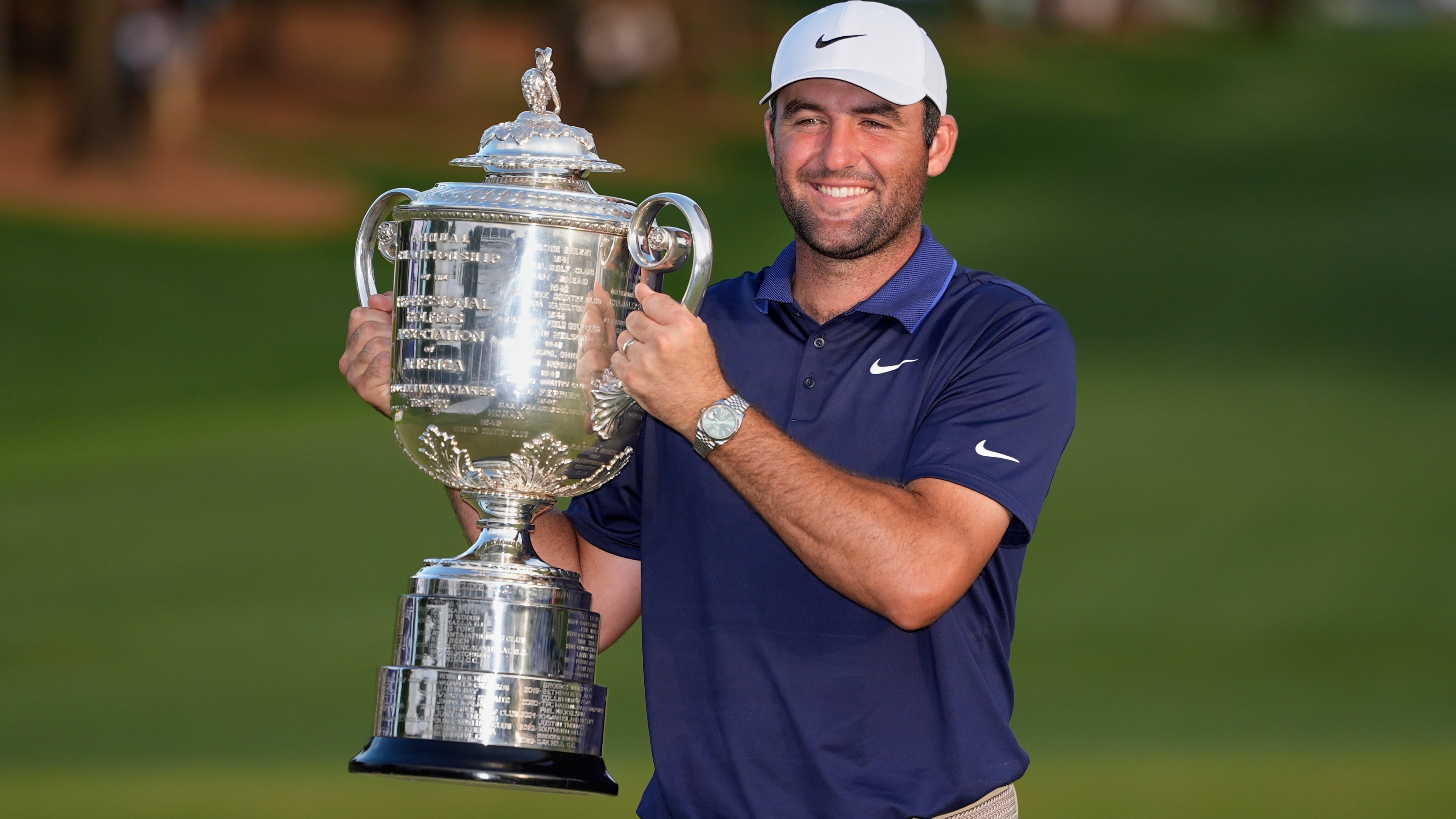 Scottie Scheffler holds the Wanamaker trophy after winning the PGA Championship golf...