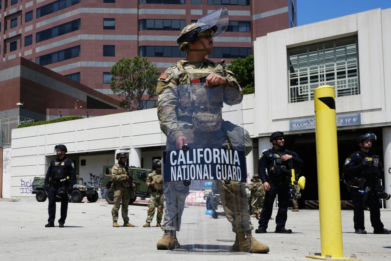 U.S. National Guard stand protect buildings Tuesday, June 10, 2025, in Los Angeles.