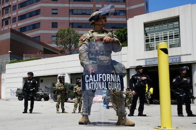 U.S. National Guard stand protect buildings Tuesday, June 10, 2025, in Los Angeles.