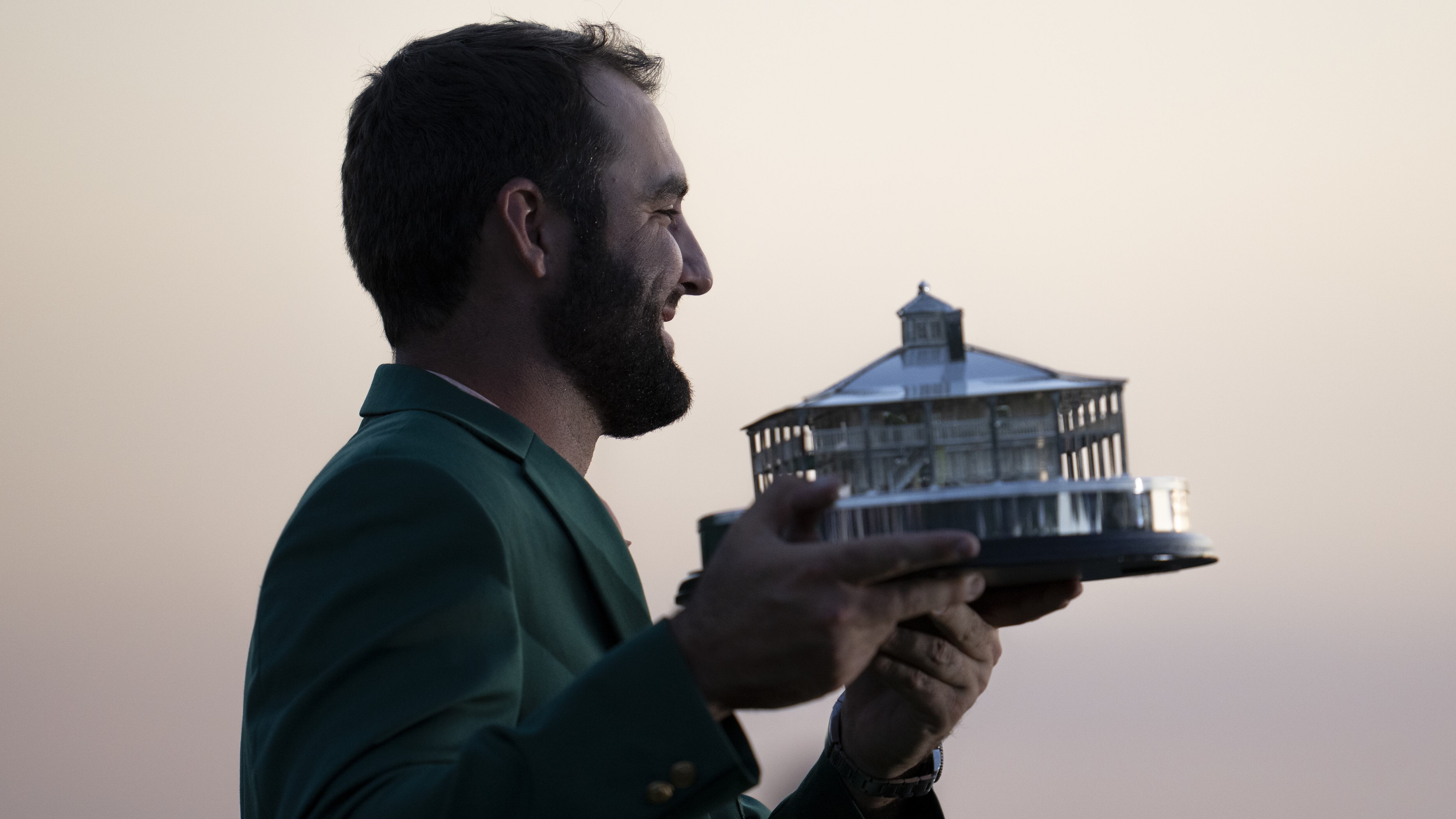 Masters champion Scottie Scheffler of the United States lifts the Masters Trophy during the...