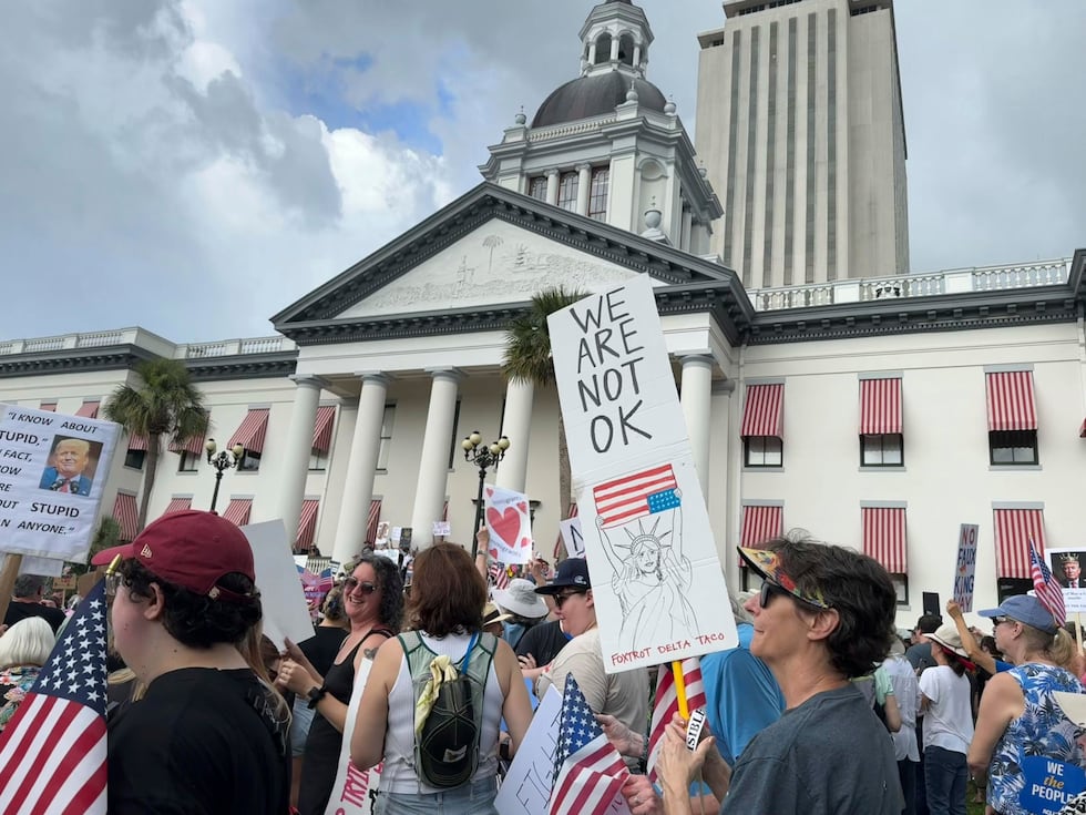 People gather on the grounds of Florida’s old capitol in Tallahassee, Fla., for “No Kings”...