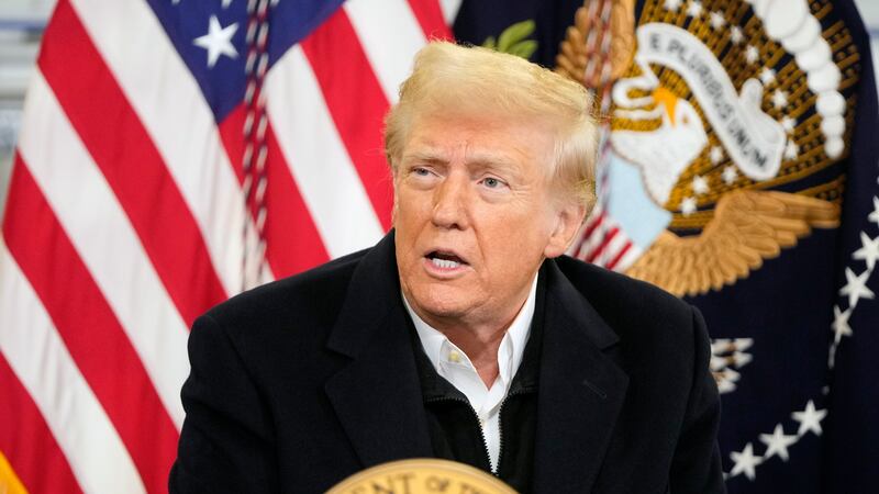 President Donald Trump is briefed on the effects of Hurricane Helene at Asheville Regional...