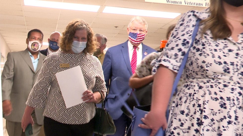 Rep. Rick Allen (in flag mask) walks through the Charlie Norwood VA Medical Center during a...