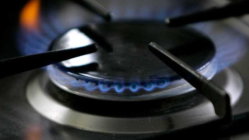 FILE - A gas-lit flame burns on a natural gas stove on Jan. 11, 2006. The...