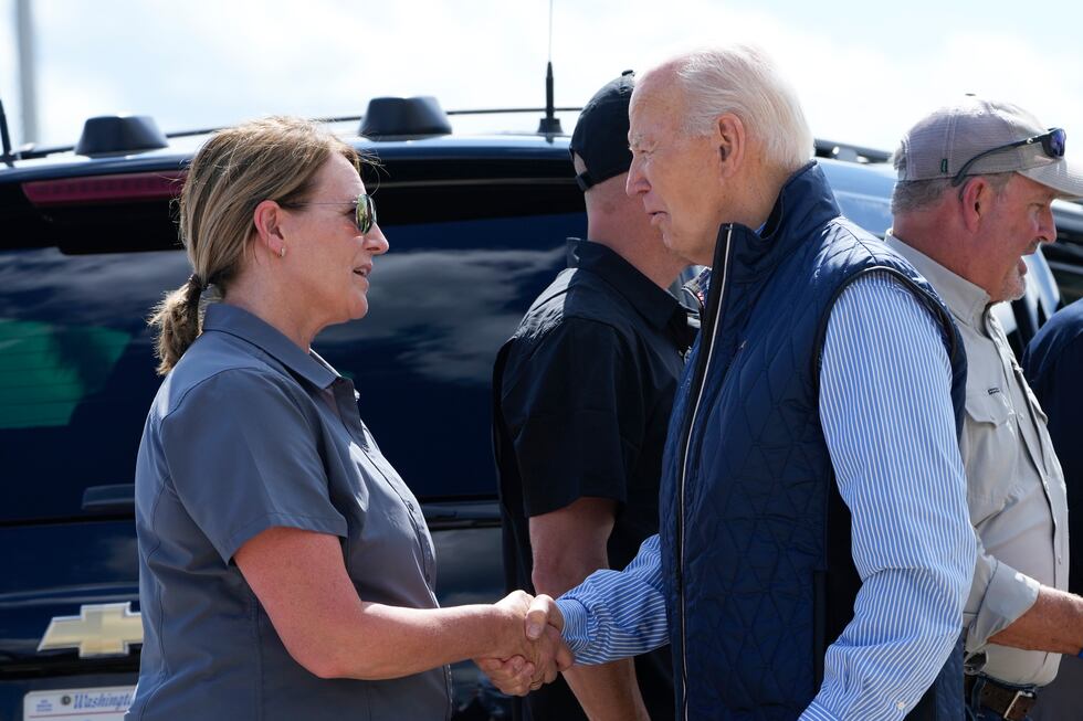 President Joe Biden talks with Deanne Criswell, of the Federal Emergency...