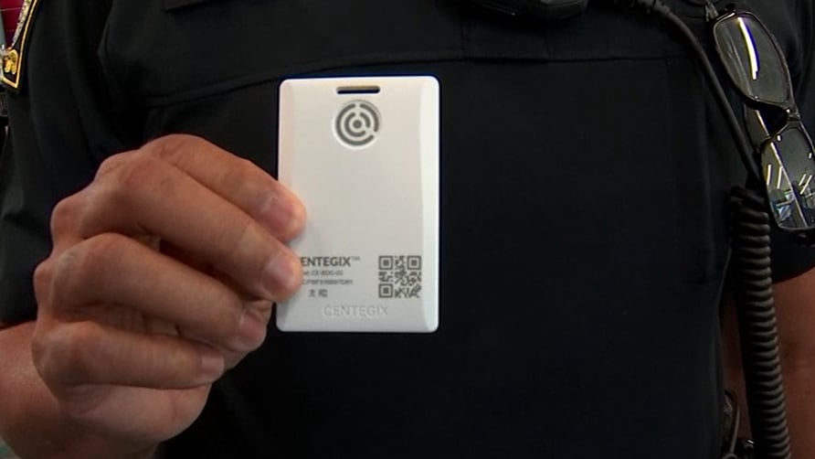 APS Police Chief Ronald Applin holds up the 'panic buttons' given to all district teachers and...