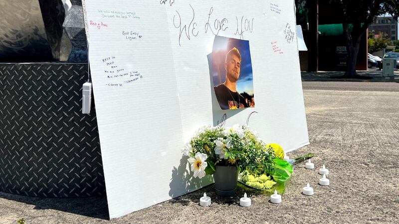 An impromptu memorial honors Logan Etterle near where he was killed in Augusta.