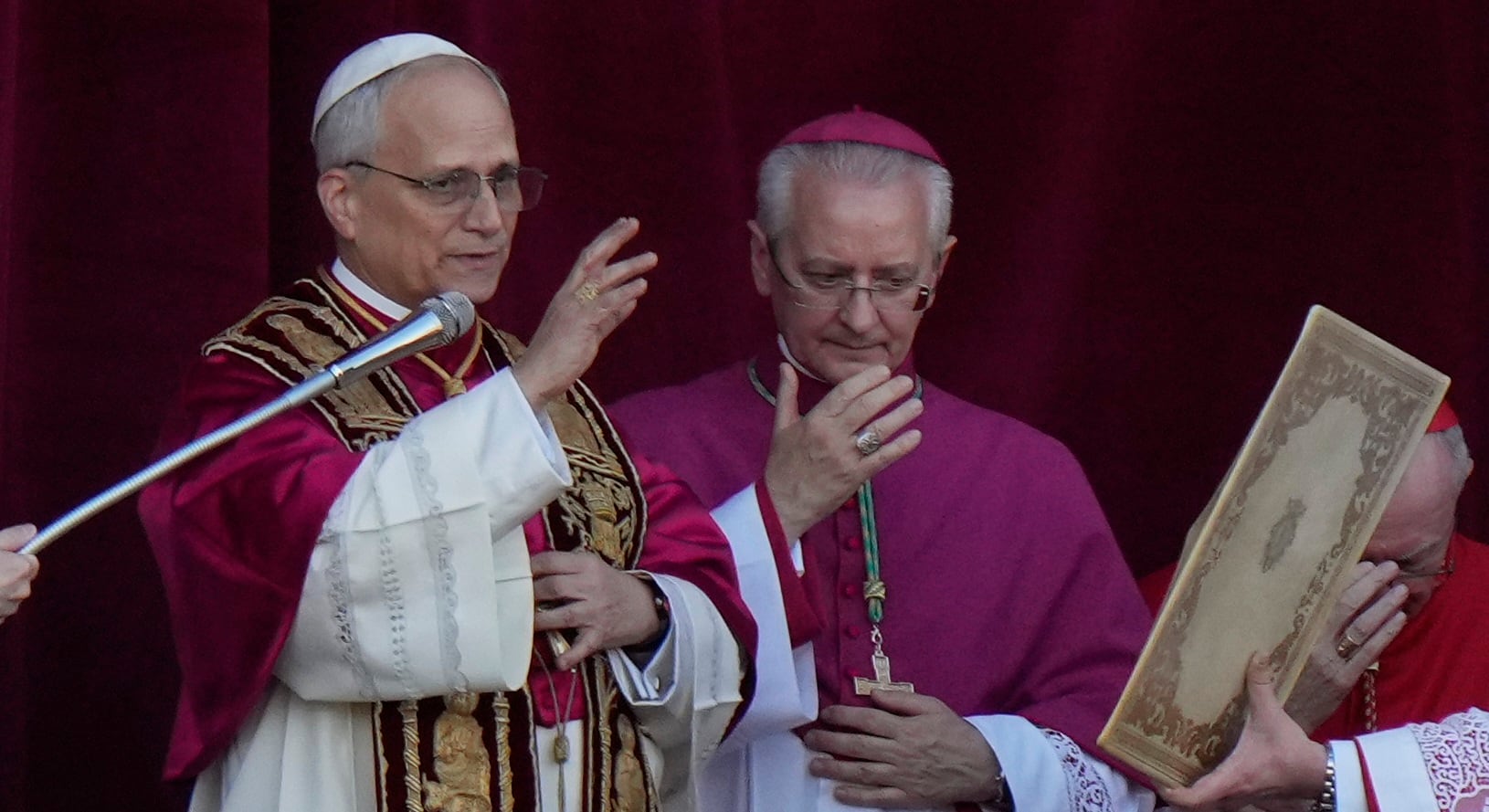 Pope Leo XIV delivers his blessing from the balcony of St Peter's Basilica after his election,...
