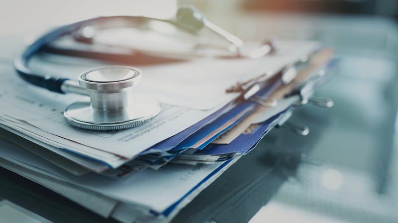 Stethoscope on top of paperwork