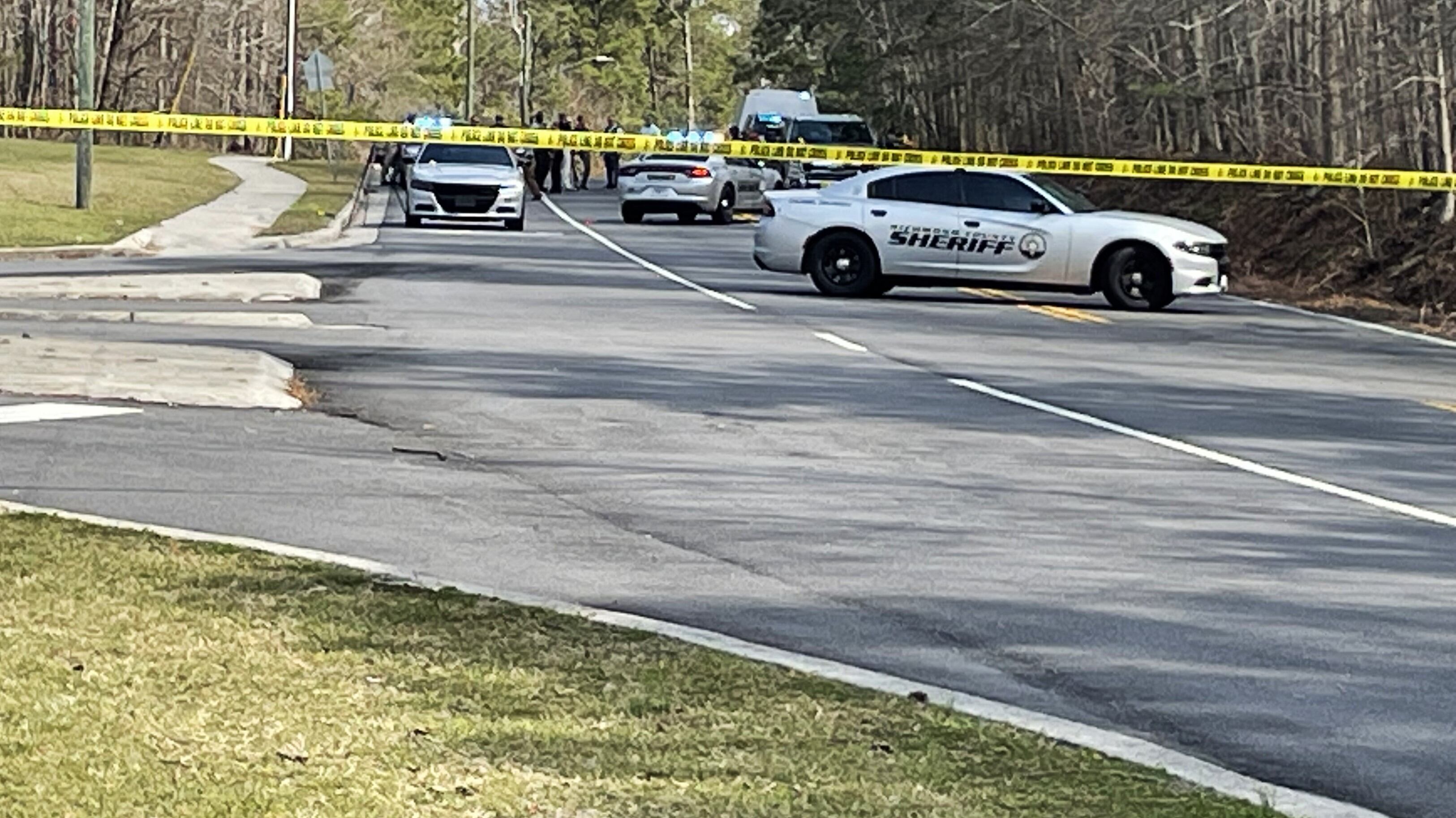 Deputies block the road in front of Glenn Hills Middle School, where a deputy shot a suspect...