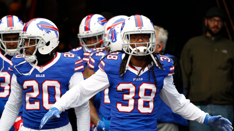 Buffalo Bills defensive back Sergio Brown (38) and Corey Graham (20) walk toward the field...