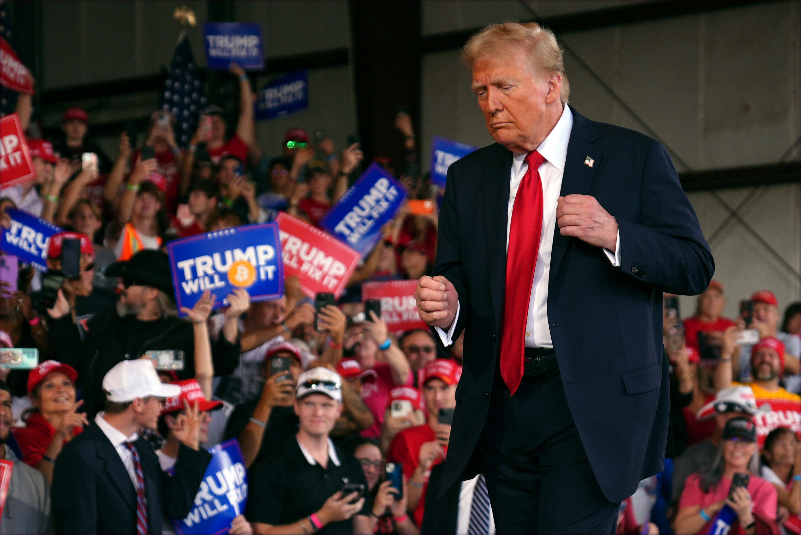 Republican presidential nominee former President Donald Trump dances at a campaign rally at...