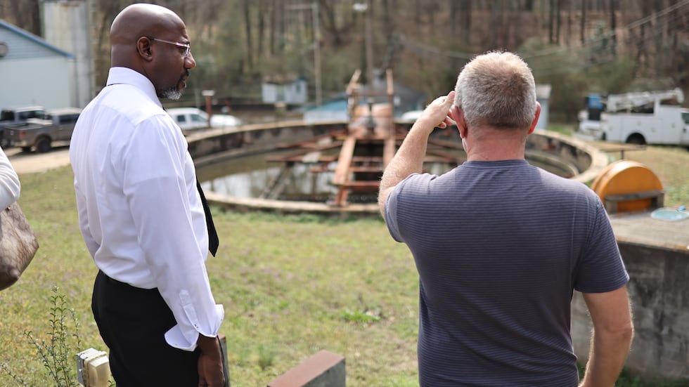 Sen. Raphael Warnock surveys Social Circle’s wastewater treatment site, which officials say...