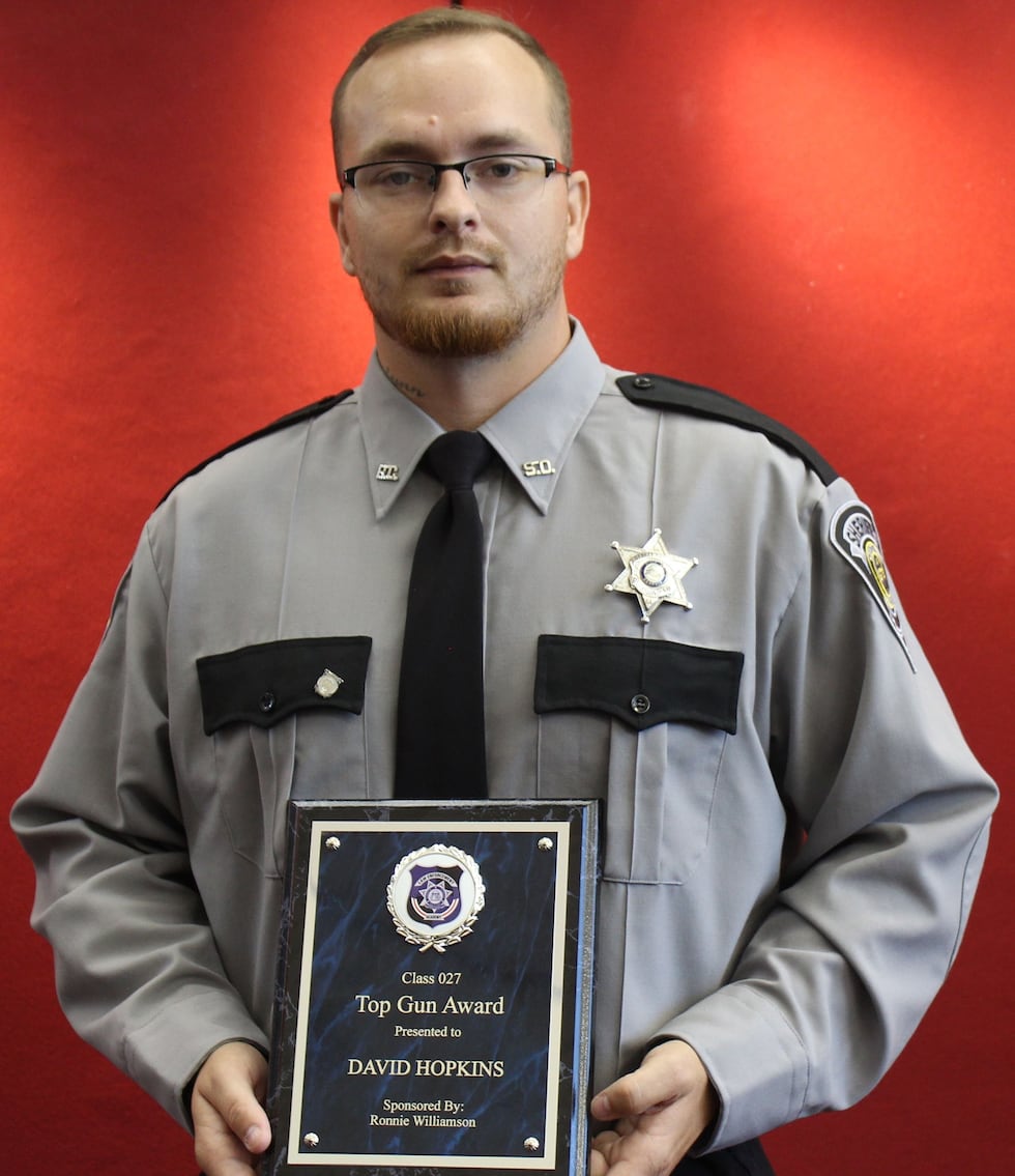 Deputy David Hopkins is show with his "Top Gun" award from the Richmond County Sheriff's...