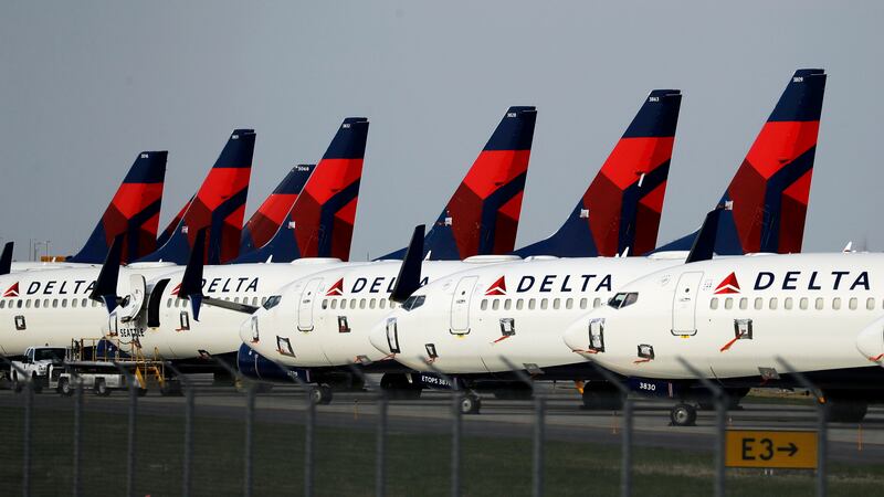 FILE - In this April 1, 2020 file photo, several dozen Delta Air Lines jets are parked at...