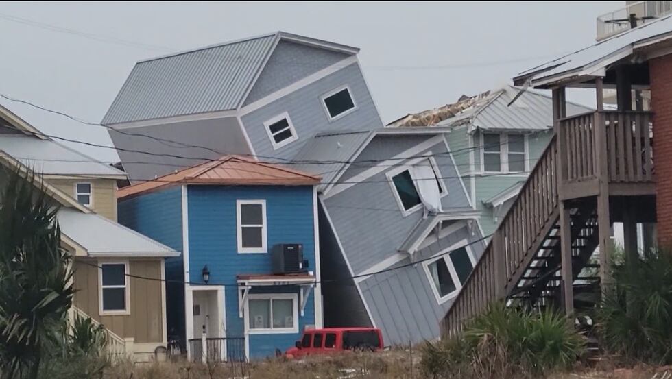 A home appears to be leaning on another home after a significant storm rolled through Panama...