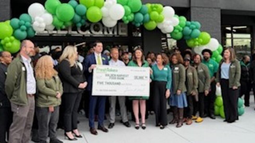 FreshTake presented Golden Harvest Food Bank with a $5,000 check during the grand opening...