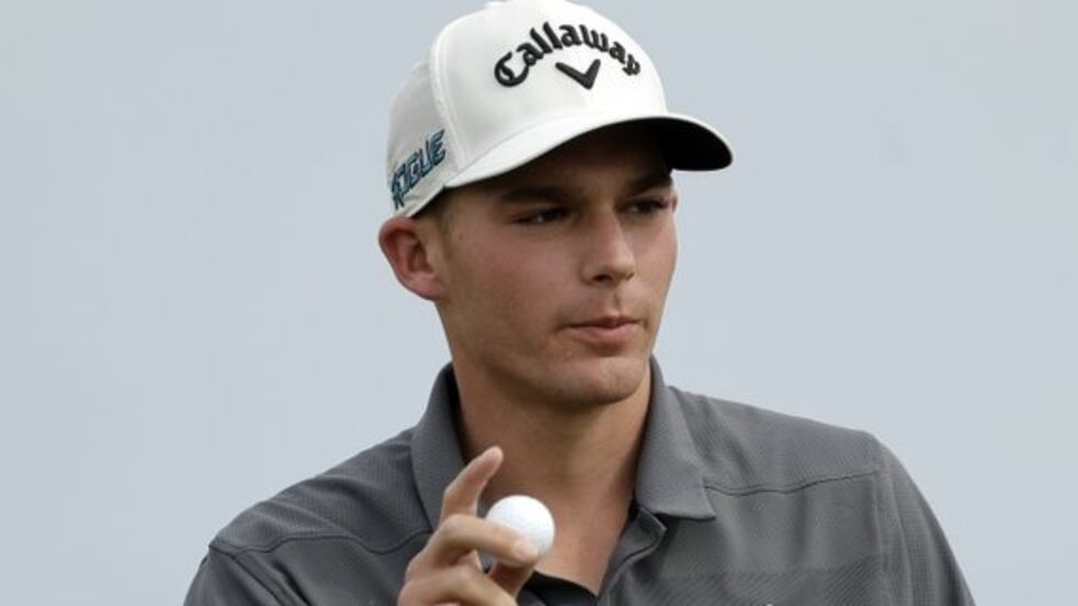 Aaron Wise acknowledges applause from the gallery after sinking a putt for birdie on the fifth...