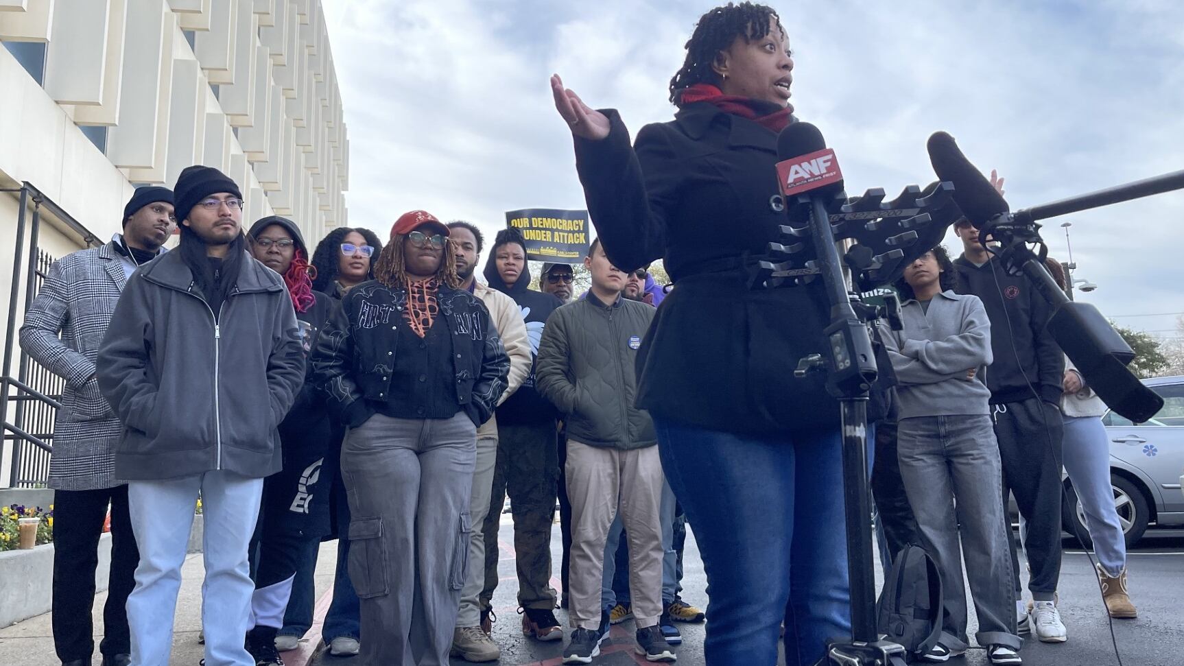 JaMae Rooks, a fired employee of New Georgia Project, speaks outside the group's headquarters...