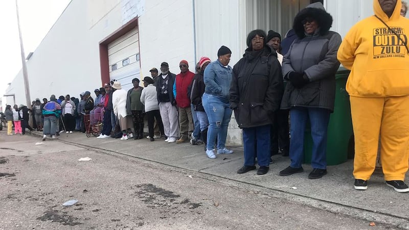 People wait in line for free water in Denmark