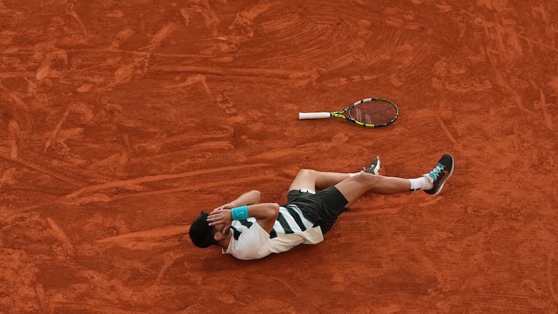 Spain's Carlos Alcaraz celebrates after winning the final match of the French Tennis Open...