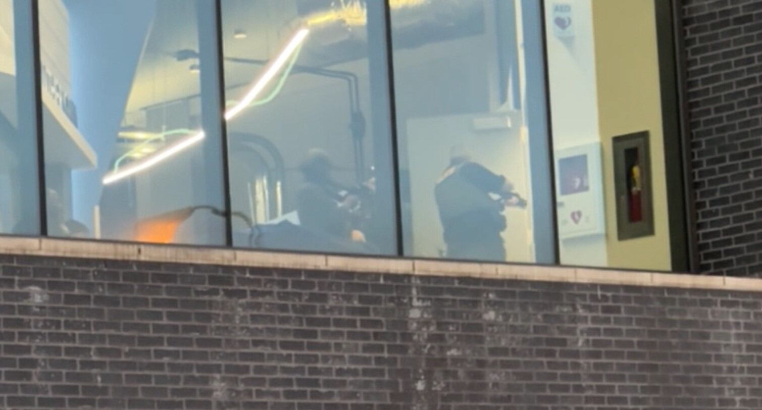 Officers were seen sweeping a building on the campus of Georgia State after receiving a threat...