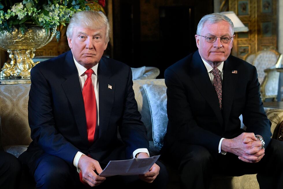 FILE - President Donald Trump, center, sits with retired Army Lt. Gen. Keith Kellogg, right,...