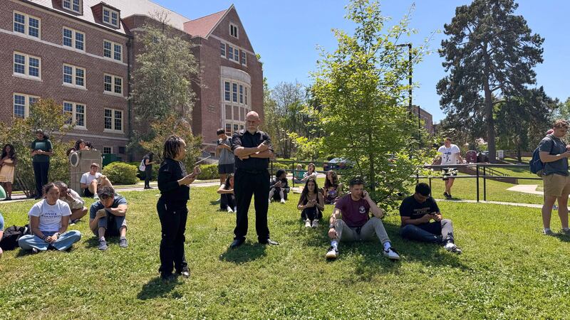 Florida State University students wait for news amid an active shooter incident at the...