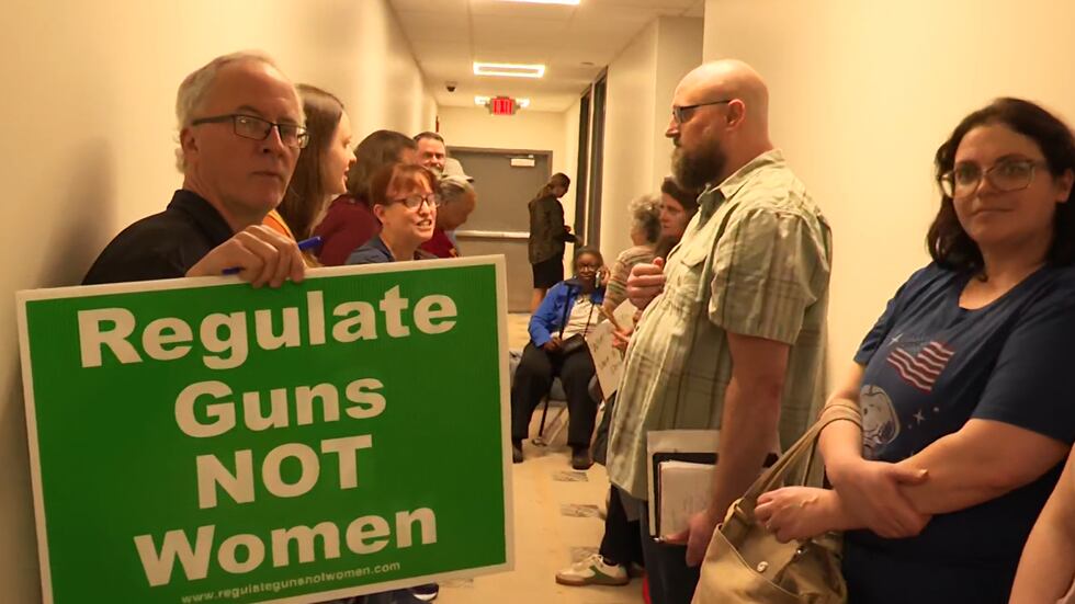 People brought in all kinds of signs during a protest Thursday at Rep. Rick Allen's Augusta...