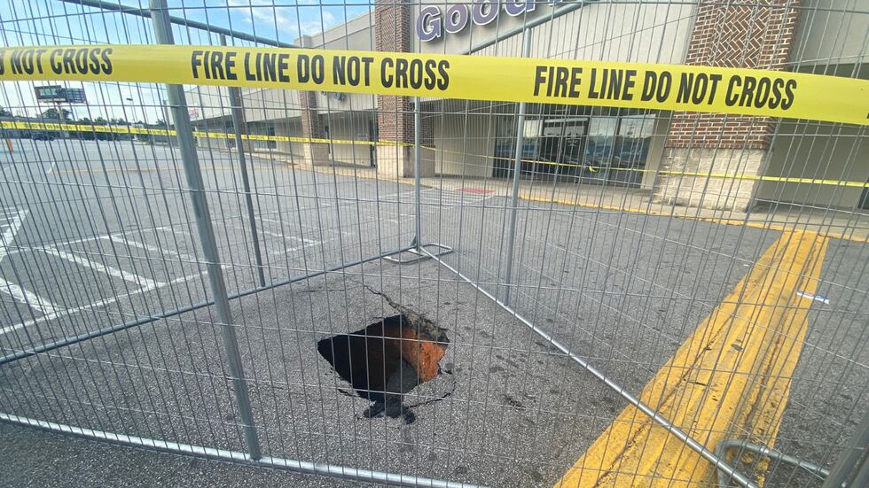 The Augusta Fire Department confirms a firetruck got stuck in a sinkhole in front of Goodwill...