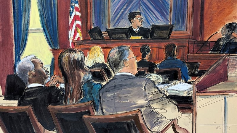 Sean 'Diddy' Combs, far left, looks on from the defense table with his attorneys, as a...