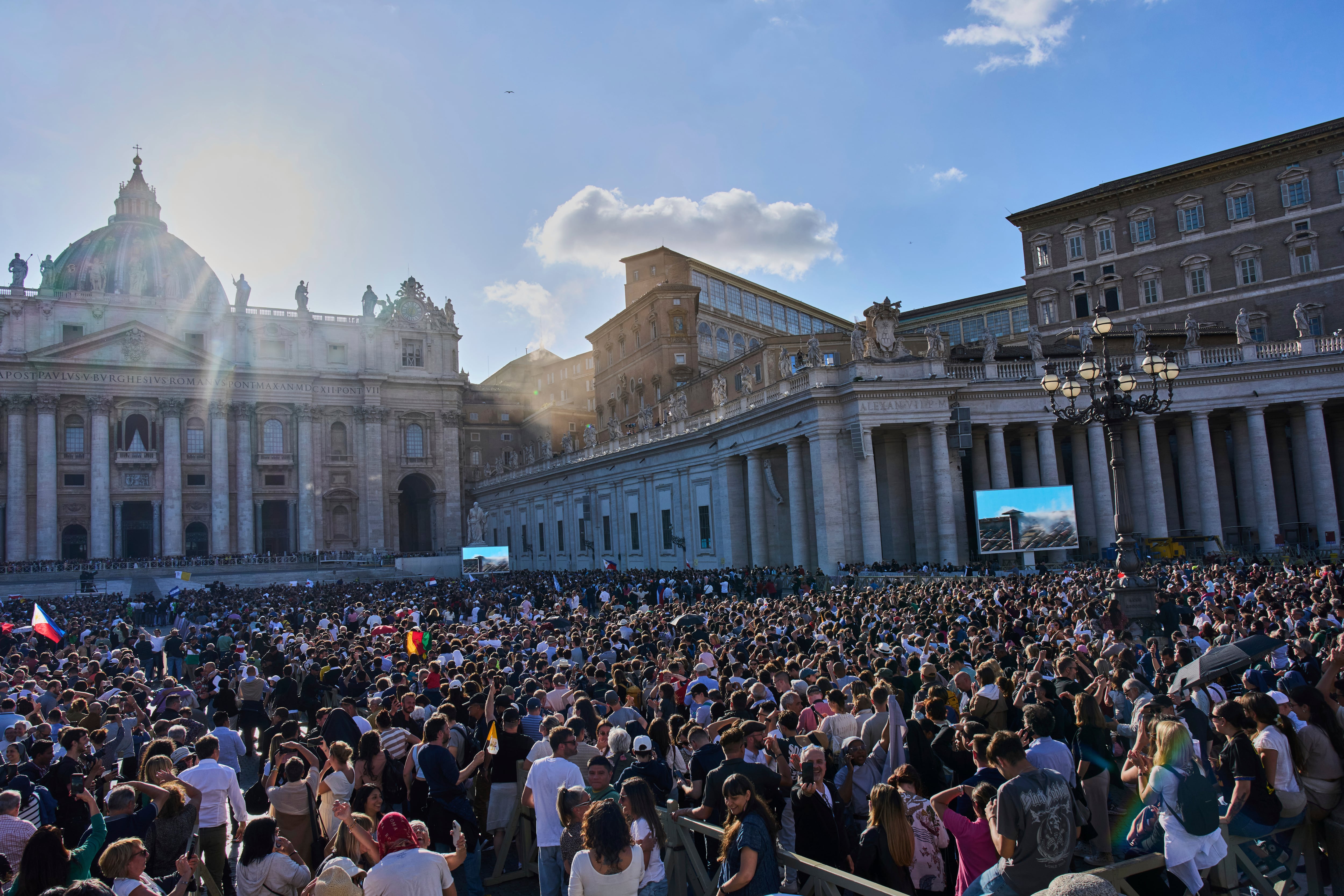 White smoke billows from the chimney of the Sistine Chapel where 133 cardinals are gathering...