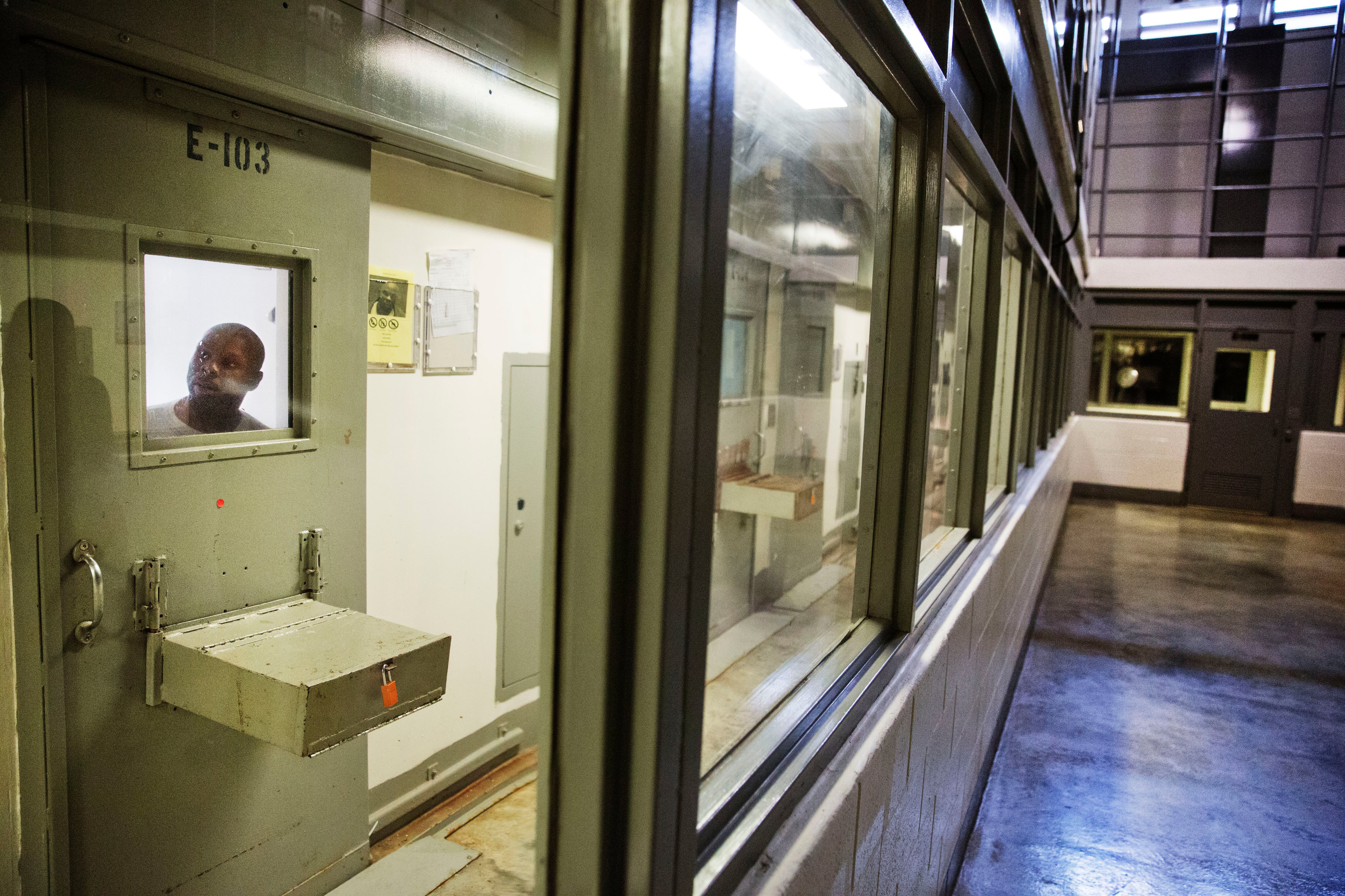 FILE - An inmate looks out of his cell in the the Special Management Unit, known as high-max...