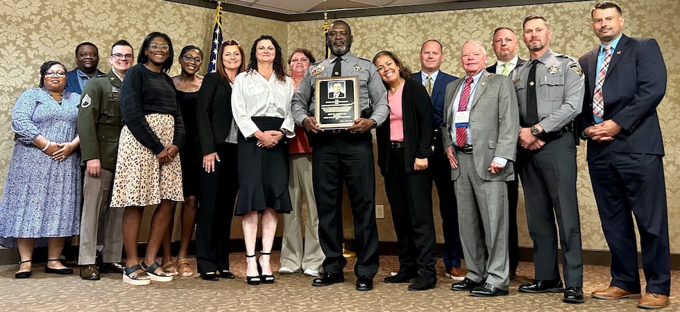Capt. Eric Abdullah, center, received teh Strom Thurmond Award for Excellence in Law Enforcement.