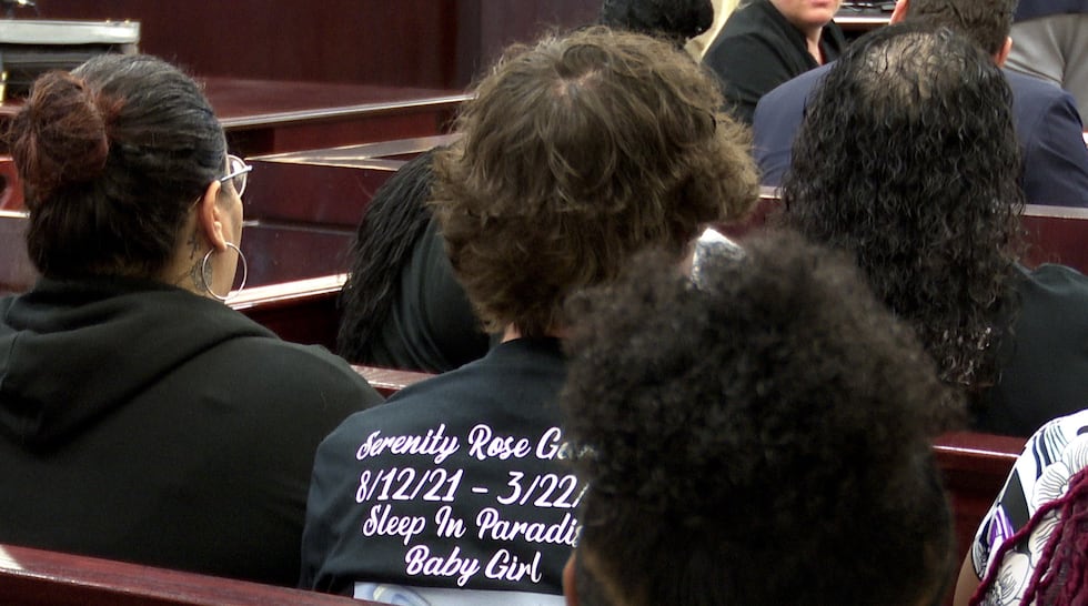 "Sleep In Paradise, Baby Girl," says T-shorts worn by several courtroom observers in the...