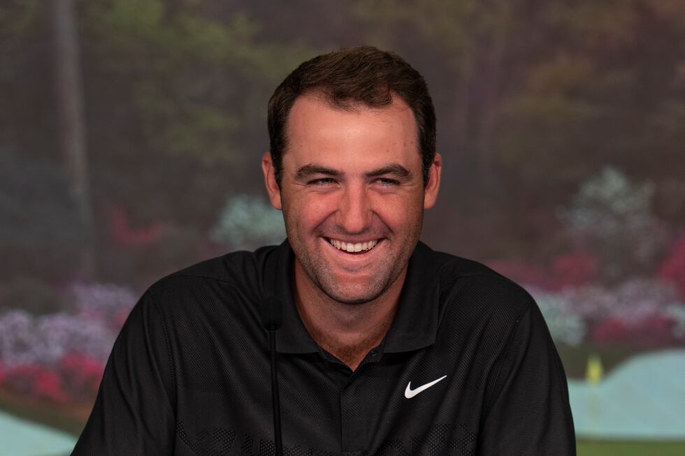 Masters champion Scottie Scheffler of the United States speaks to of the media in a...