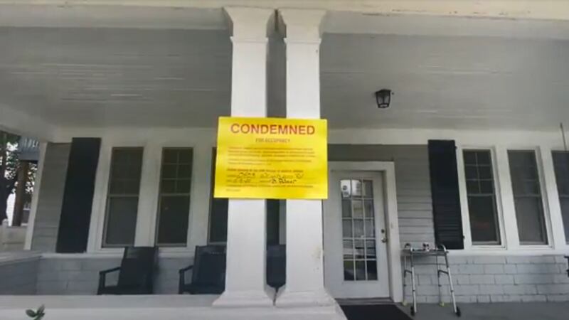 A "condemned" sign is posted outside First Love Personal Care Home after two people were found...
