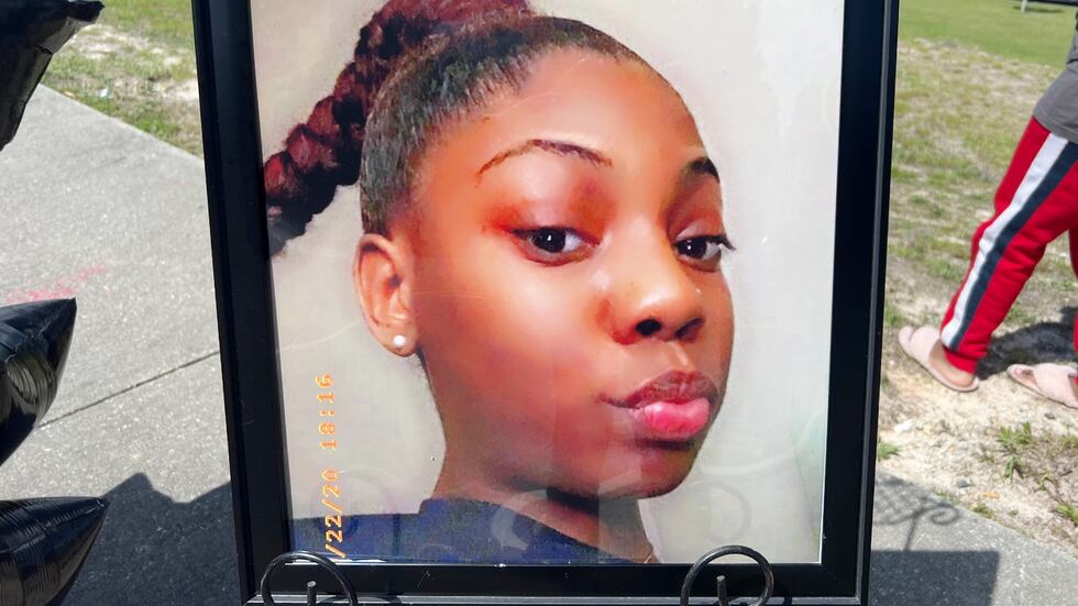 A photo of Cheyenne Grace is displayed at a memorial to the 17-year-old where she died.