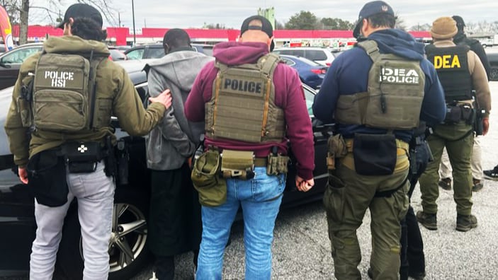 Federal agents in Atlanta take part in an immigration operation.