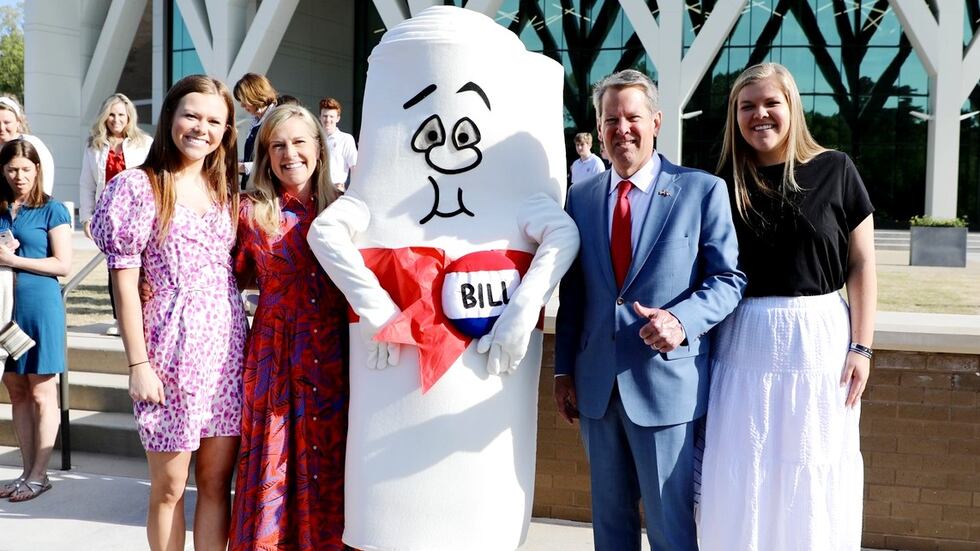 Georgia Gov. Brian Kemp and family pose for a photo during a bill-g ceremony on April...