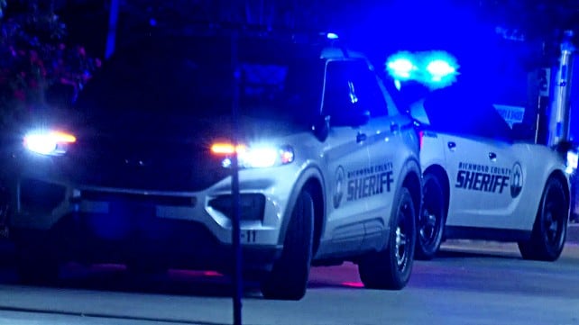 Richmond County Sheriff's Office vehicles outside a convenience store that was shot up by...