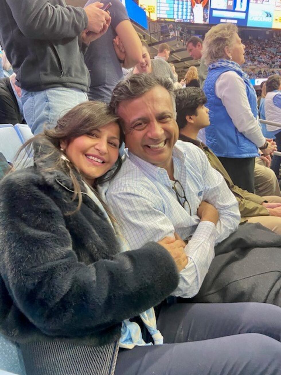 Dr. Henry Patel and his wife, Shital, attend a basketball game before his ing in 2020