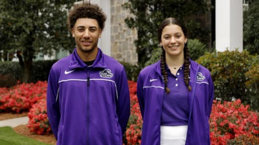 Payne College scholarship recipients Devin Smith and Taya Buxton after a news conference for...