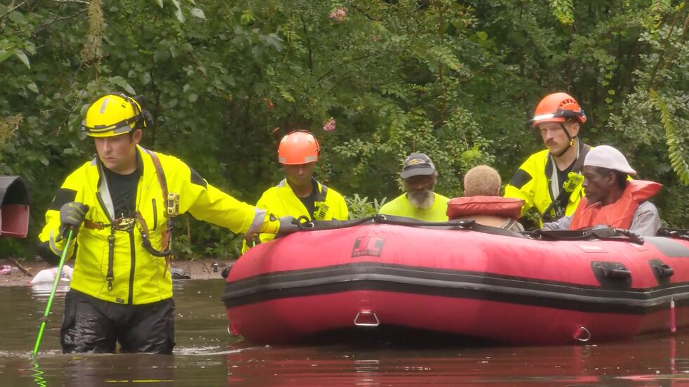 Floodwaters trap people inside their homes