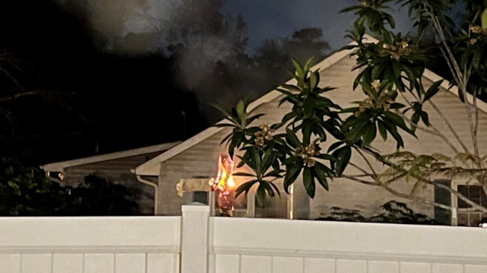 Footage taken by Monica Williams shows a cross being burned while facing their property on...