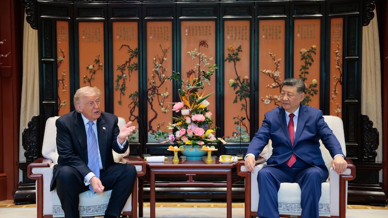 Chinese President Xi Jinping and U.S. President Donald Trump attend a meeting on the sidelines...