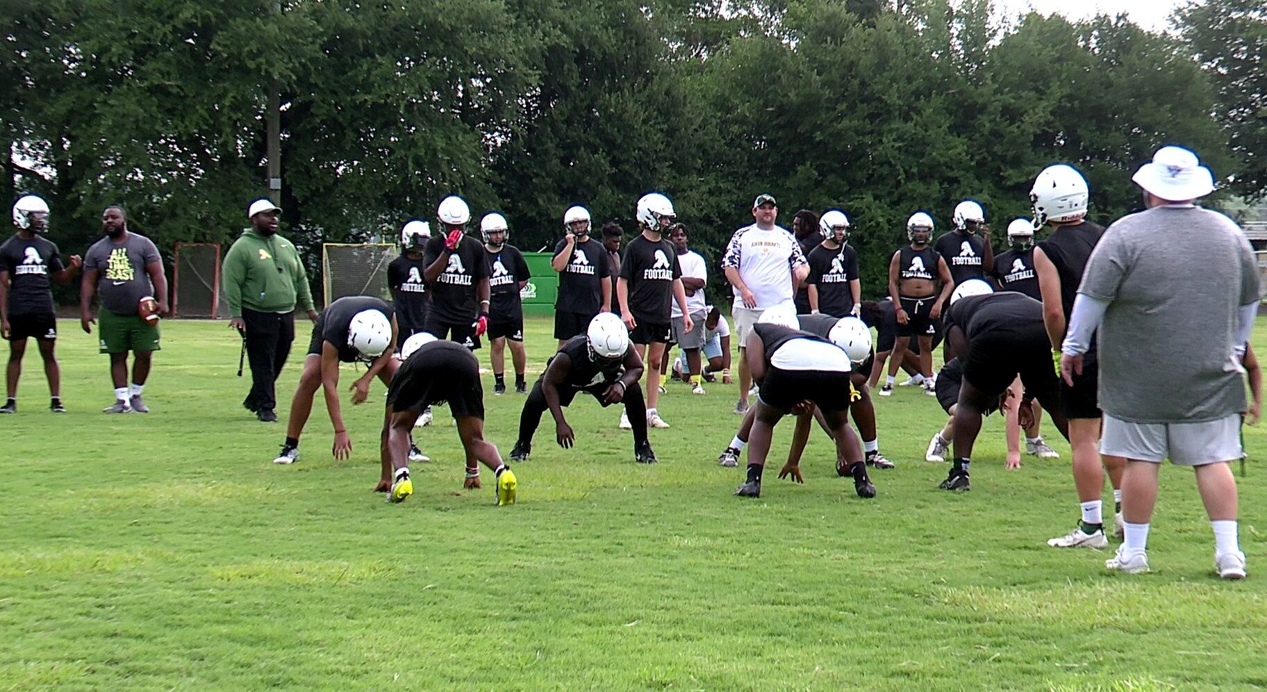 Aiken football teams manage without full-time trainers