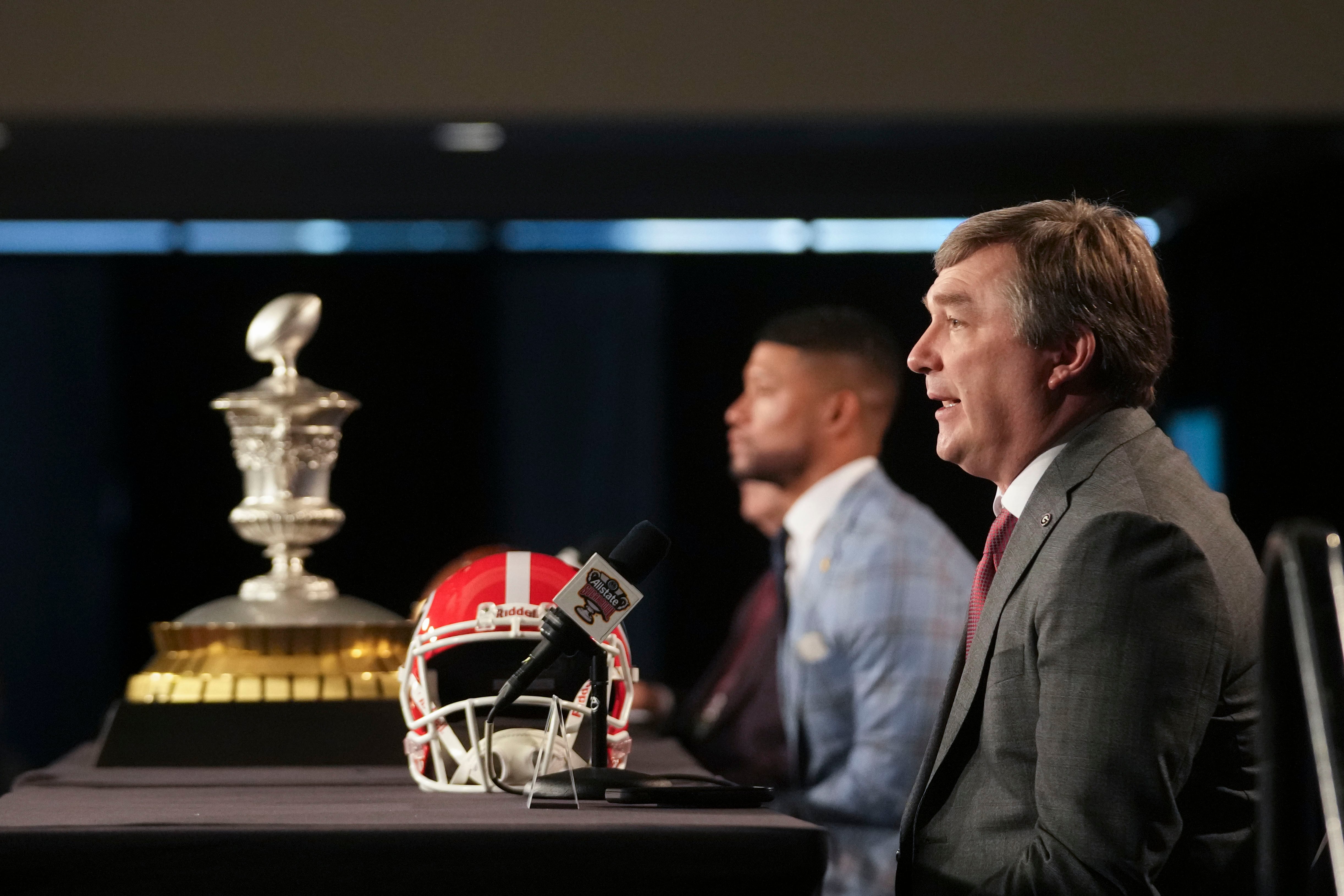 Georgia head coach Kirby Smart speaks to reporters with Notre Dame head coach Marcus Freeman,...