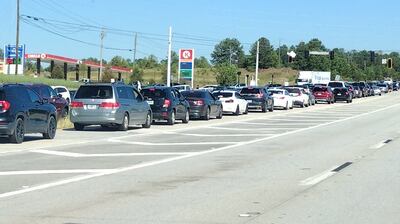 A line of cars waits to get to the Kroger Marketplace along Jimmie Dyess Parkway near Fort...